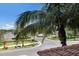 View of the street below showcasing lush landscaping and a glimpse of the neighborhood amenities at 1064 N Tamiami Trl # 1219, Sarasota, FL 34236