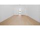 Bright bedroom with wood floors, neutral walls, and an en-suite bathroom at 709 Tuscanny St, Brandon, FL 33511