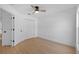 Bedroom with ceiling fan features closet and ample natural light at 709 Tuscanny St, Brandon, FL 33511