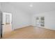 Bright bedroom boasts wood floors and french doors to backyard at 709 Tuscanny St, Brandon, FL 33511