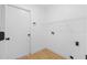 Laundry room features shelving and washer and dryer hookups at 709 Tuscanny St, Brandon, FL 33511