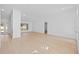 Bright open-concept living room with wood floors, neutral walls, and modern recessed lighting at 709 Tuscanny St, Brandon, FL 33511