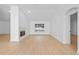 Spacious living room featuring a fireplace, wood flooring, and an open layout at 709 Tuscanny St, Brandon, FL 33511