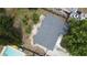 Aerial view of roof and backyard featuring a small wooden deck and grass at 8399 78Th N Ave, Seminole, FL 33777