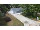 Charming home with a fenced yard, mature trees, and a long driveway at 8399 78Th N Ave, Seminole, FL 33777