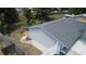 Aerial view of the house featuring a wooden deck and landscaping at 8399 78Th N Ave, Seminole, FL 33777