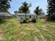 Well sized backyard featuring grass and a small wooden deck at 8399 78Th N Ave, Seminole, FL 33777