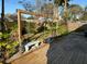 Backyard deck featuring patio set, garden, and wooden fence at 8399 78Th N Ave, Seminole, FL 33777