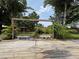 Backyard deck featuring patio set, garden, and wooden fence at 8399 78Th N Ave, Seminole, FL 33777