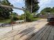Backyard deck featuring patio set, garden, and wooden fence at 8399 78Th N Ave, Seminole, FL 33777