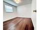 Bright bedroom featuring wood floors and a window with blinds at 8399 78Th N Ave, Seminole, FL 33777