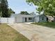 Charming single-story home with a long driveway and a white picket fence for added curb appeal at 8399 78Th N Ave, Seminole, FL 33777