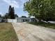 Charming home with a long driveway and a well maintained front lawn at 8399 78Th N Ave, Seminole, FL 33777