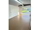 Open garage door with interior view of floor, door and driveway at 8399 78Th N Ave, Seminole, FL 33777