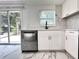 Updated kitchen featuring stainless steel appliances and white cabinetry and quartz countertops at 8399 78Th N Ave, Seminole, FL 33777