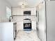 Modern kitchen featuring white cabinets, stainless steel appliances, and marble countertops at 8399 78Th N Ave, Seminole, FL 33777