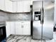 Bright kitchen with stainless steel appliances, quartz countertops, and white cabinetry at 8399 78Th N Ave, Seminole, FL 33777