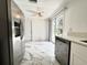 Contemporary kitchen with stainless steel appliances, access to the patio and quartz countertops at 8399 78Th N Ave, Seminole, FL 33777