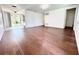 Spacious living room featuring hardwood floors, white walls, and recessed lighting at 8399 78Th N Ave, Seminole, FL 33777