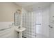 Modern bathroom featuring unique glass block and contemporary fixtures at 408 Eunice Dr, Plant City, FL 33563