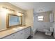 Bright bathroom features a large vanity with lots of storage and natural light at 408 Eunice Dr, Plant City, FL 33563
