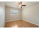 Bedroom featuring hardwood floors, neutral paint, and a window with blinds at 408 Eunice Dr, Plant City, FL 33563