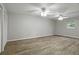 Spacious bedroom featuring modern ceiling fans and beautiful wood-look floors at 408 Eunice Dr, Plant City, FL 33563