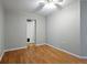 Neutral-painted bedroom featuring hardwood floors and closet access at 408 Eunice Dr, Plant City, FL 33563
