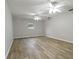 Spacious bedroom featuring modern ceiling fans and beautiful wood-look floors at 408 Eunice Dr, Plant City, FL 33563