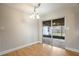 Neutral-painted dining area with hardwood floors and sliding doors to patio at 408 Eunice Dr, Plant City, FL 33563