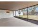 Covered back patio with sliding glass doors, perfect for outdoor relaxation at 408 Eunice Dr, Plant City, FL 33563