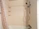 Bathroom shower stall features a shower head and built-in corner shelving at 408 Eunice Dr, Plant City, FL 33563