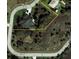 An aerial view showcases the lot and home's location in a circular neighborhood at 2668 Jablo Cir, North Port, FL 34288