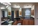 Bathroom with granite countertops, dual sinks, large mirrors and ample cabinet space at 2668 Jablo Cir, North Port, FL 34288