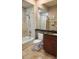 Bathroom with updated tile, granite countertop vanity, and tub with shower at 2668 Jablo Cir, North Port, FL 34288