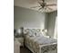 Cozy bedroom with two bedside tables with lamps and white wooden accents at 2668 Jablo Cir, North Port, FL 34288