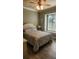 Comfortable bedroom featuring a ceiling fan and a cozy window seat at 2668 Jablo Cir, North Port, FL 34288