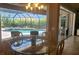 Dining table near pool with a great view of the backyard at 2668 Jablo Cir, North Port, FL 34288