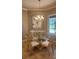 Cozy dining area featuring a chandelier and view to outdoors at 2668 Jablo Cir, North Port, FL 34288