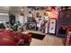 This garage offers epoxy flooring, a red car, motorcycles, and Texaco-themed decor at 2668 Jablo Cir, North Port, FL 34288