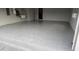 Spacious garage featuring a glossy epoxy floor and wash sink at 2668 Jablo Cir, North Port, FL 34288