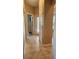 Hallway showcasing the tile floors, leading to the white doors at 2668 Jablo Cir, North Port, FL 34288