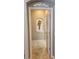 Hallway featuring tile floors and white door with archway decor and an alcove in the background at 2668 Jablo Cir, North Port, FL 34288
