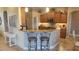 Kitchen with stainless steel appliances, a breakfast bar, and elegant bar stools at 2668 Jablo Cir, North Port, FL 34288
