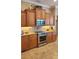 A view of the kitchen featuring stainless steel appliances and granite countertops at 2668 Jablo Cir, North Port, FL 34288