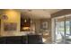 Open-concept living space with a view of the kitchen and the screened-in pool area at 2668 Jablo Cir, North Port, FL 34288