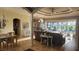 A formal living and dining area featuring an open floor plan and sliding glass doors to the pool at 2668 Jablo Cir, North Port, FL 34288