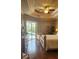 Main bedroom featuring tray ceiling and view of the pool at 2668 Jablo Cir, North Port, FL 34288