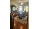 Spacious office area featuring a large table, display cabinet and ample natural light through windows at 2668 Jablo Cir, North Port, FL 34288