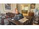 Home office space featuring a table used as a desk and a glimpse into the living room beyond at 2668 Jablo Cir, North Port, FL 34288